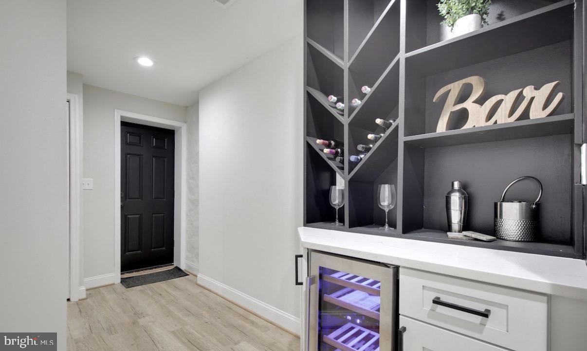 5300 Maple Avenue Baltimore, MD 21215 - Photo 7 of 13 Stylish entryway with bar elegance.