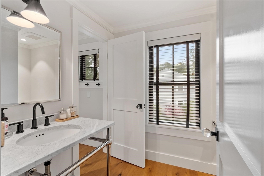 653 Main Street Concord, MA 01742 - Photo 31 of 42 a bathroom with a sink and a mirror