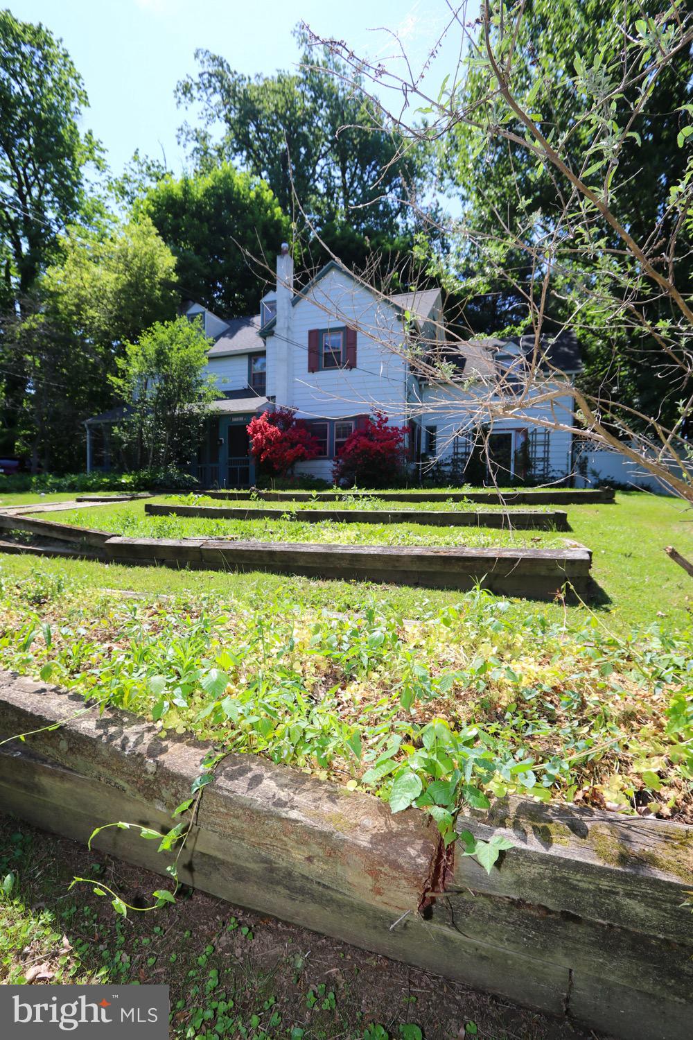 2701 Alden Road Bryn Athyn, PA 19006 - Photo 7 of 105 a front view of a house with a yard and a fountain