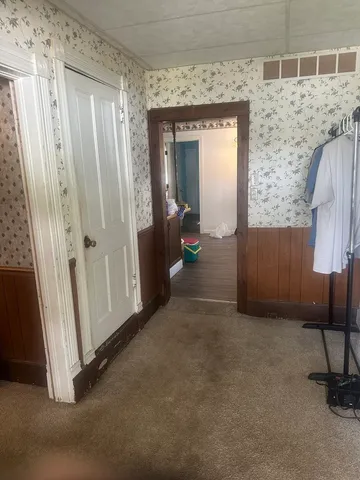 a living room with furniture and gym equipment