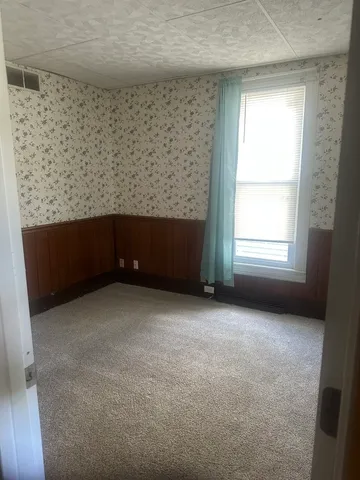 a kitchen with a sink a stove and cabinets