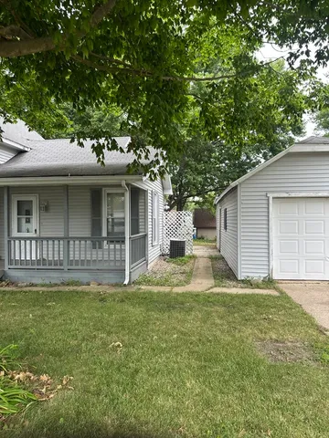 a house that has garden in front of it