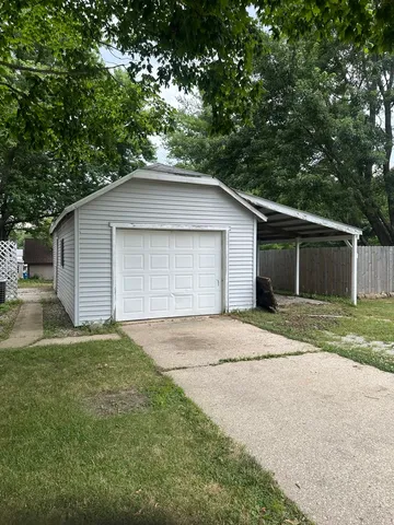 a house with a yard and a large parking space