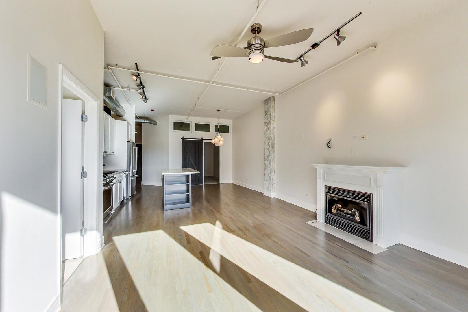 950 West Monroe Street, Unit 608 Chicago, IL 60607 - Photo 11 of 44 a living room with furniture and a fireplace
