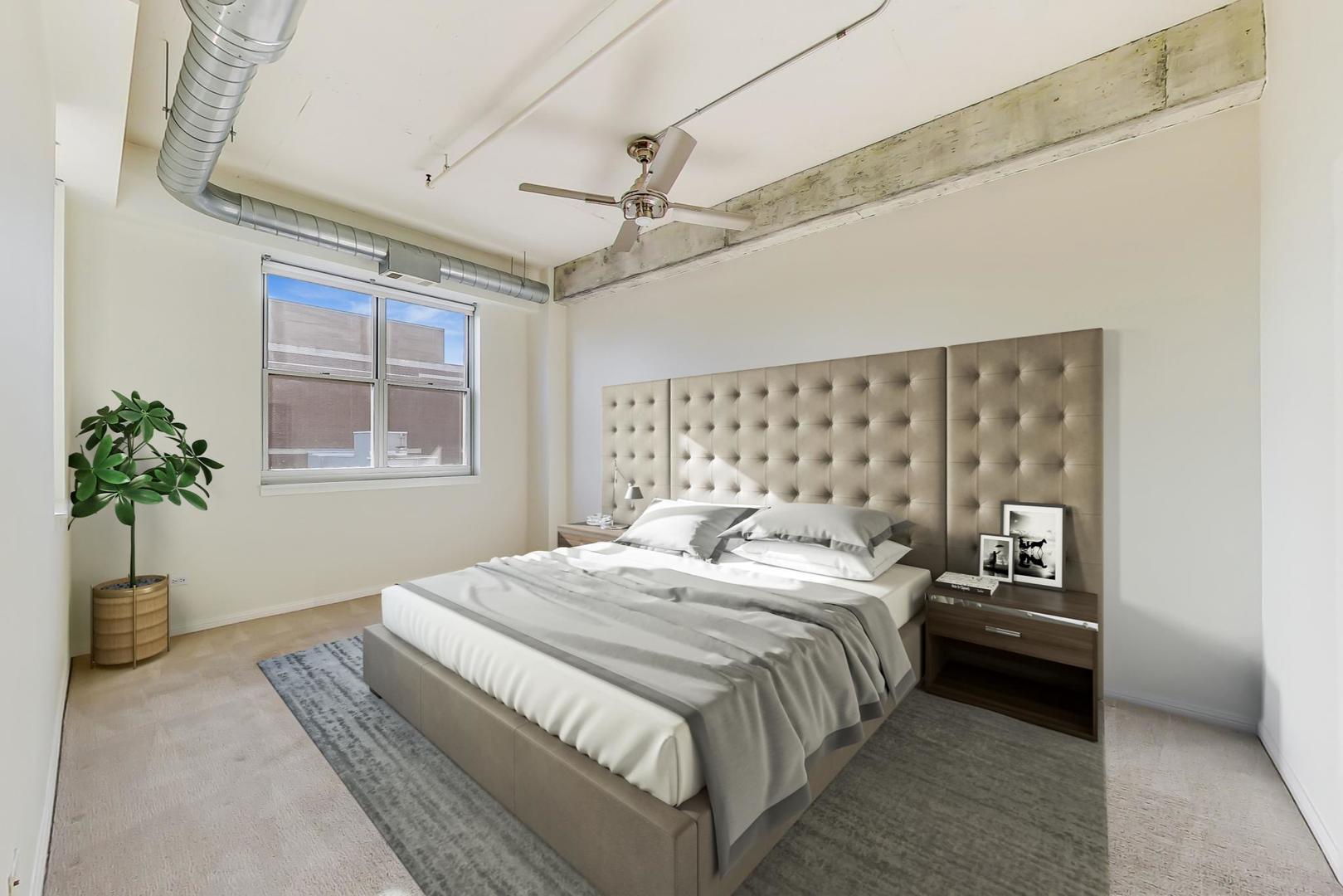 950 West Monroe Street, Unit 608 Chicago, IL 60607 - Photo 22 of 44 a bedroom with a large bed and a window