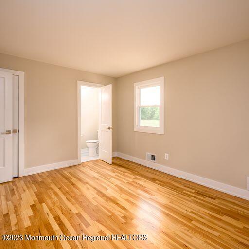117 Lemon Road Howell, NJ 07731 - Photo 15 of 31 a view of an empty room with wooden floor and a window