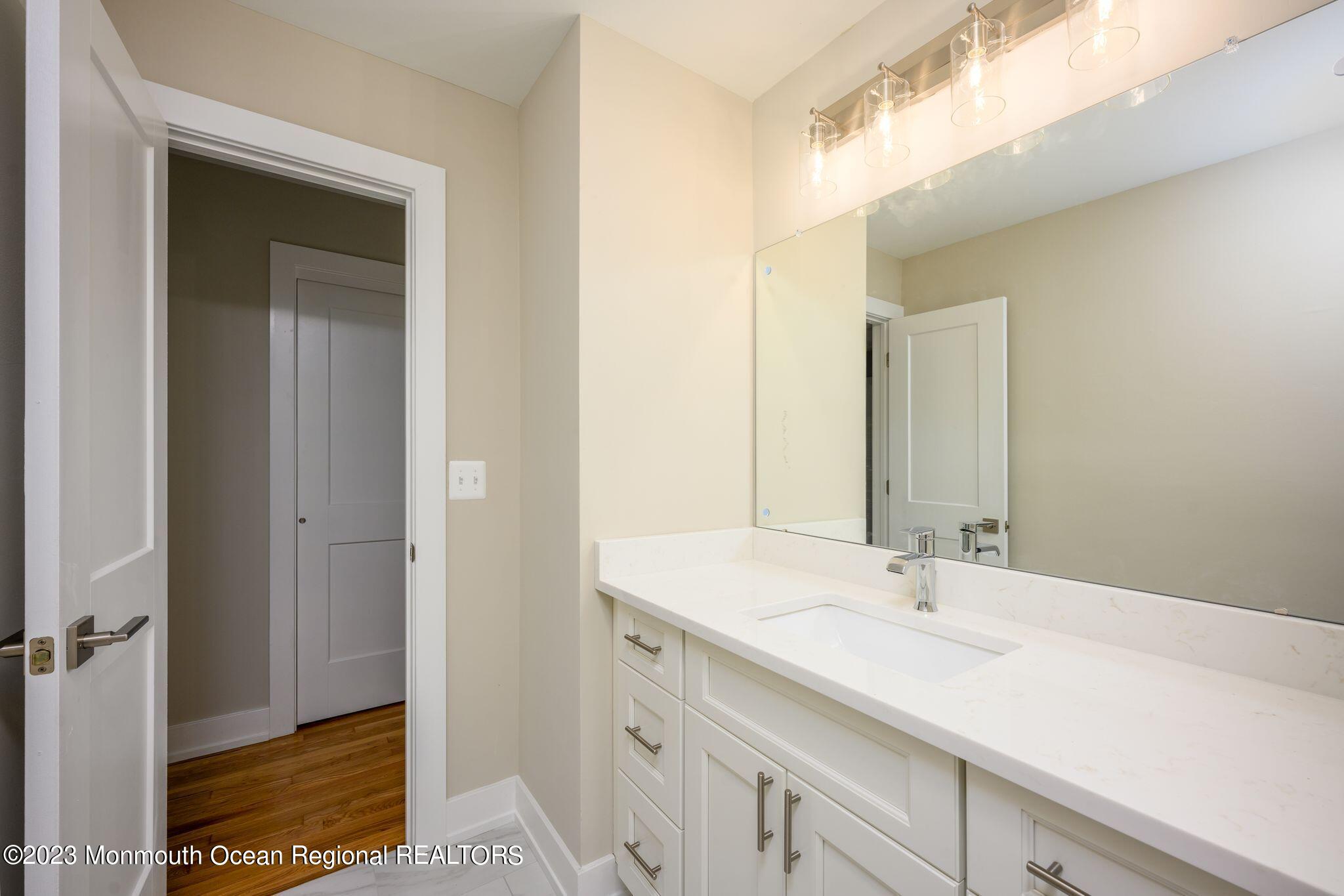 117 Lemon Road Howell, NJ 07731 - Photo 21 of 31 a bathroom with a sink and a mirror