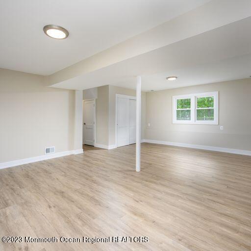 117 Lemon Road Howell, NJ 07731 - Photo 24 of 31 an empty room with wooden floor and windows