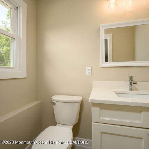 117 Lemon Road Howell, NJ 07731 - Photo 26 of 31 a bathroom with a toilet sink and mirror