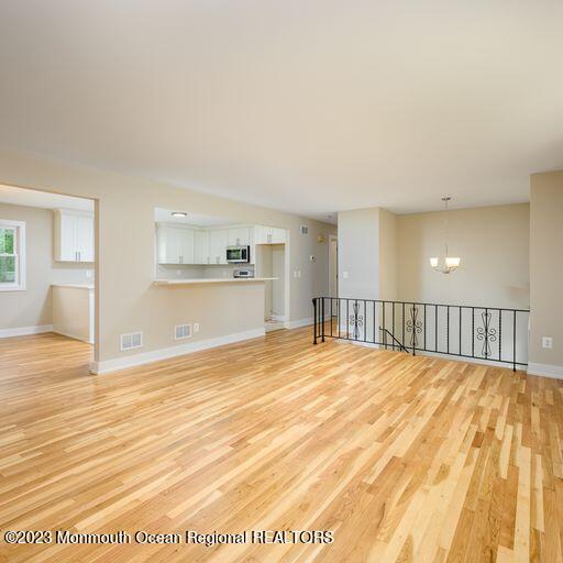 117 Lemon Road Howell, NJ 07731 - Photo 3 of 31 a view of empty room with wooden floor