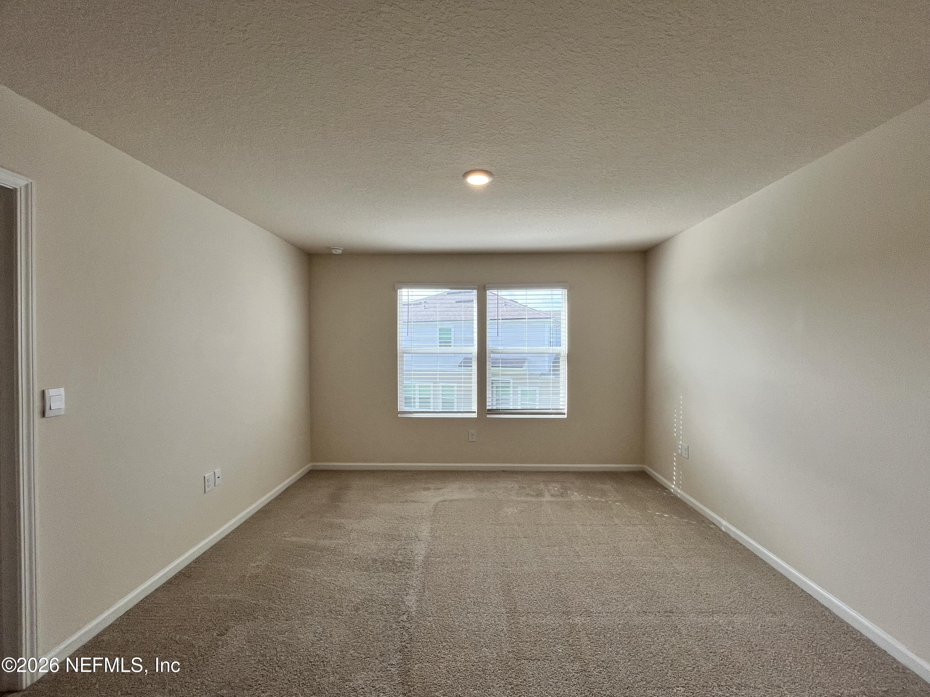 548 Coastline Way St. Augustine, FL 32092 - Photo 12 of 21 a view of an empty room with a window