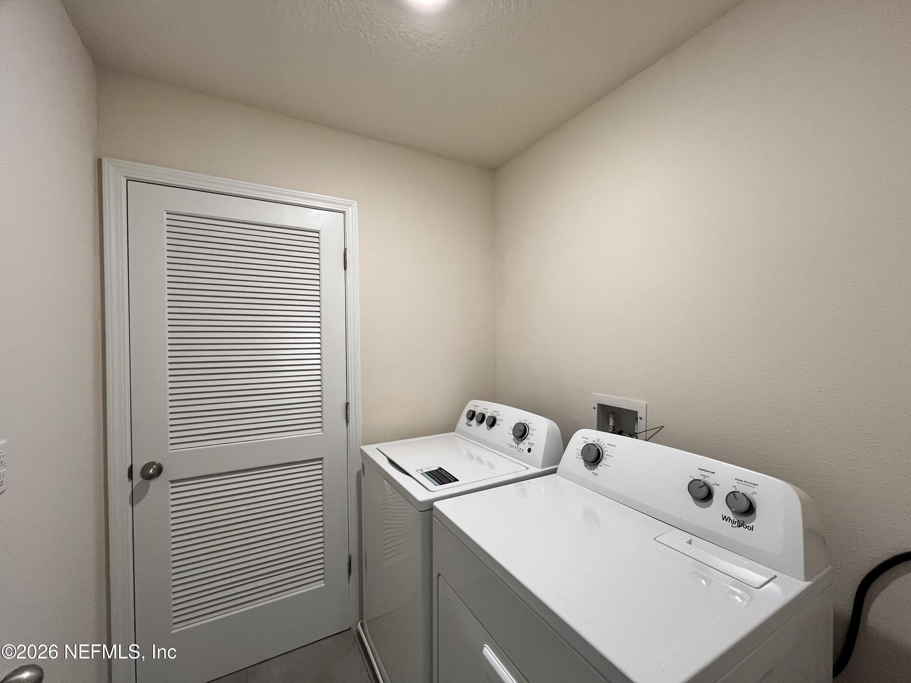 548 Coastline Way St. Augustine, FL 32092 - Photo 17 of 21 a utility room with dryer and washer