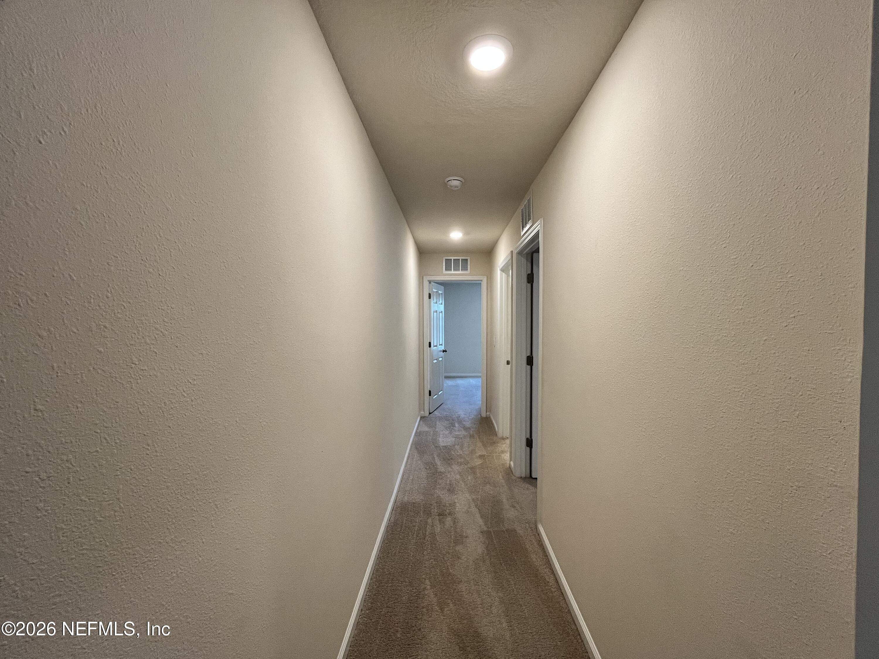 548 Coastline Way St. Augustine, FL 32092 - Photo 18 of 21 a view of hallway with wooden floor