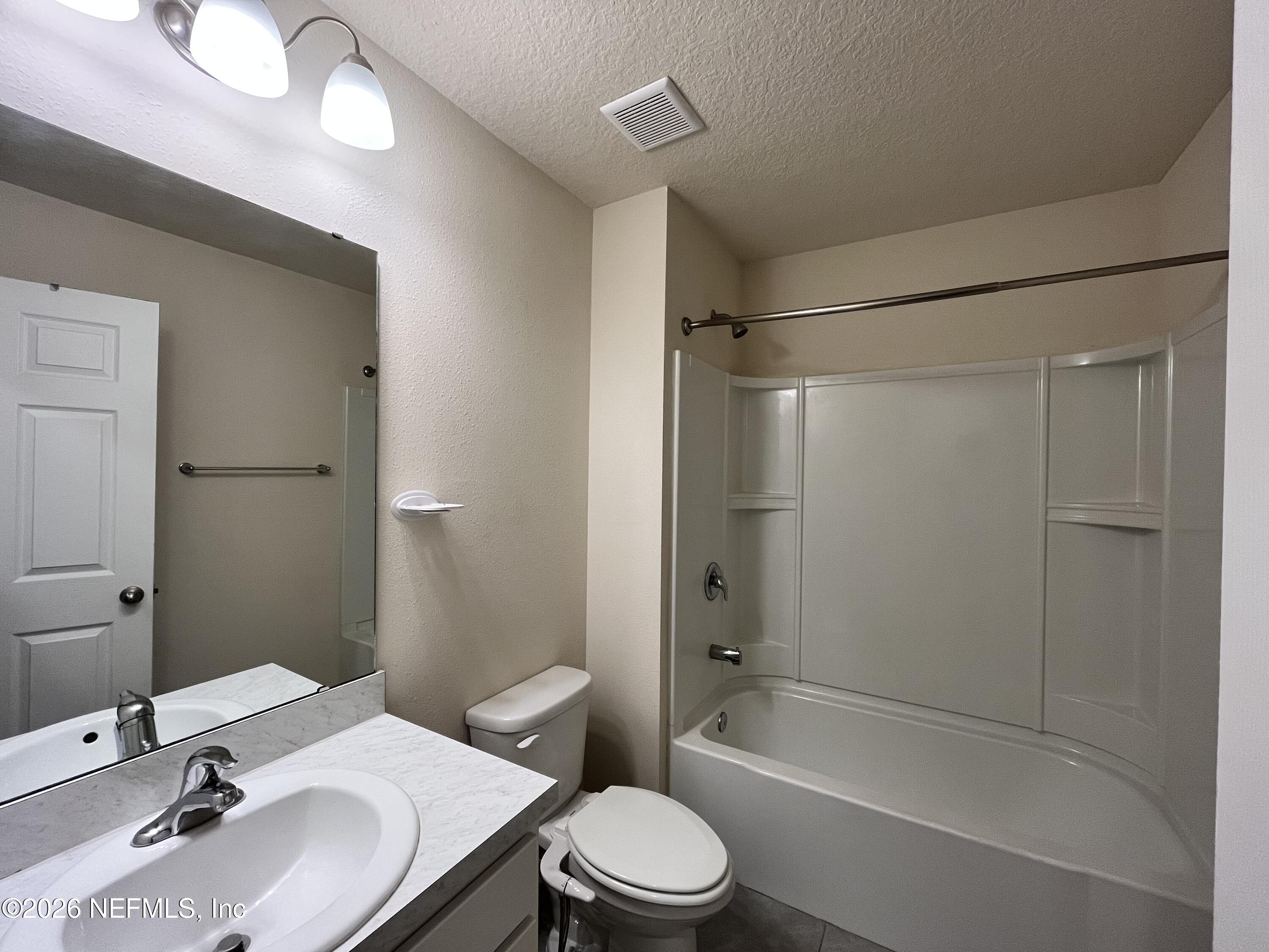 548 Coastline Way St. Augustine, FL 32092 - Photo 20 of 21 a bathroom with a sink toilet and shower