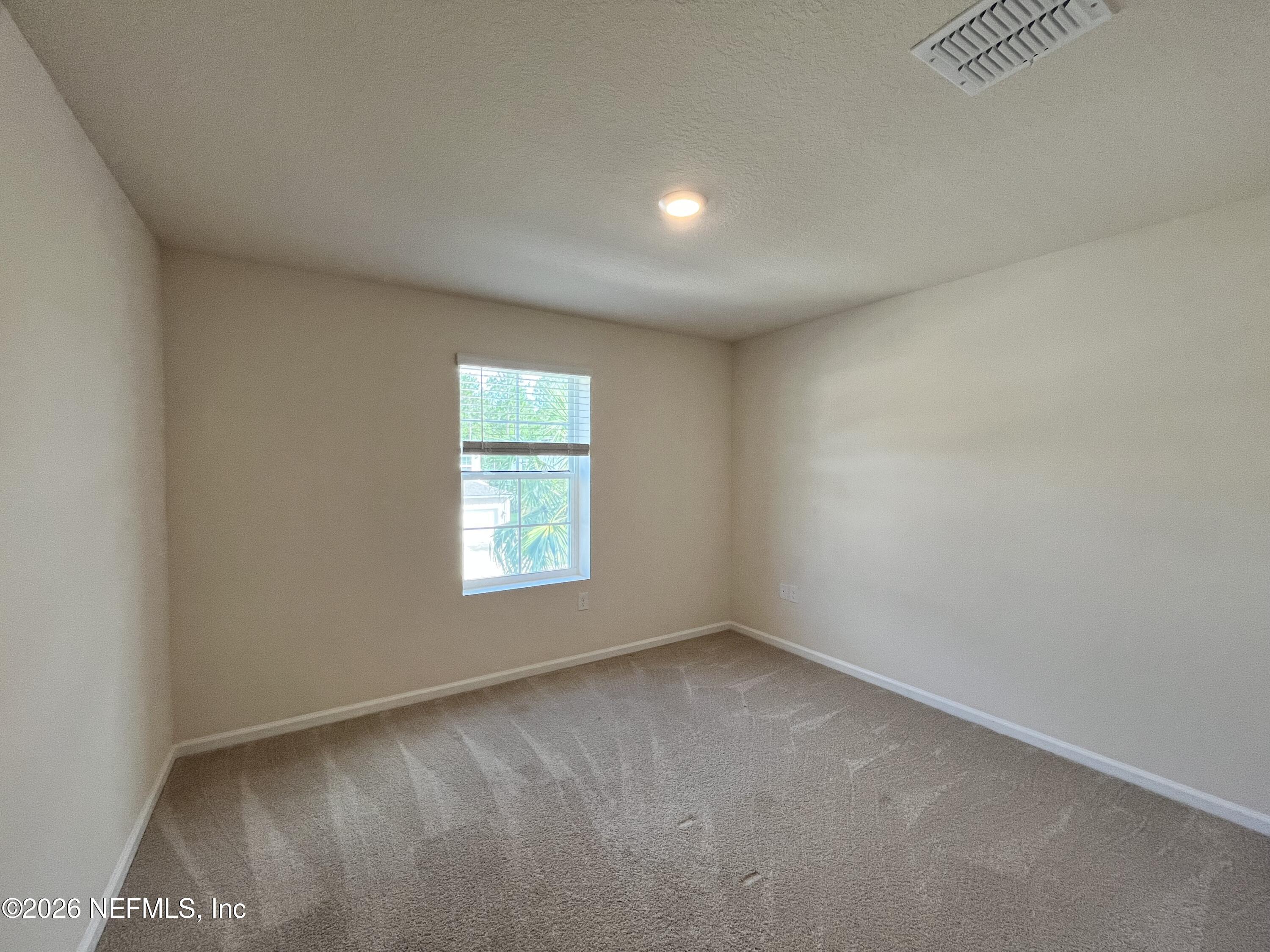 548 Coastline Way St. Augustine, FL 32092 - Photo 21 of 21 an empty room with a window