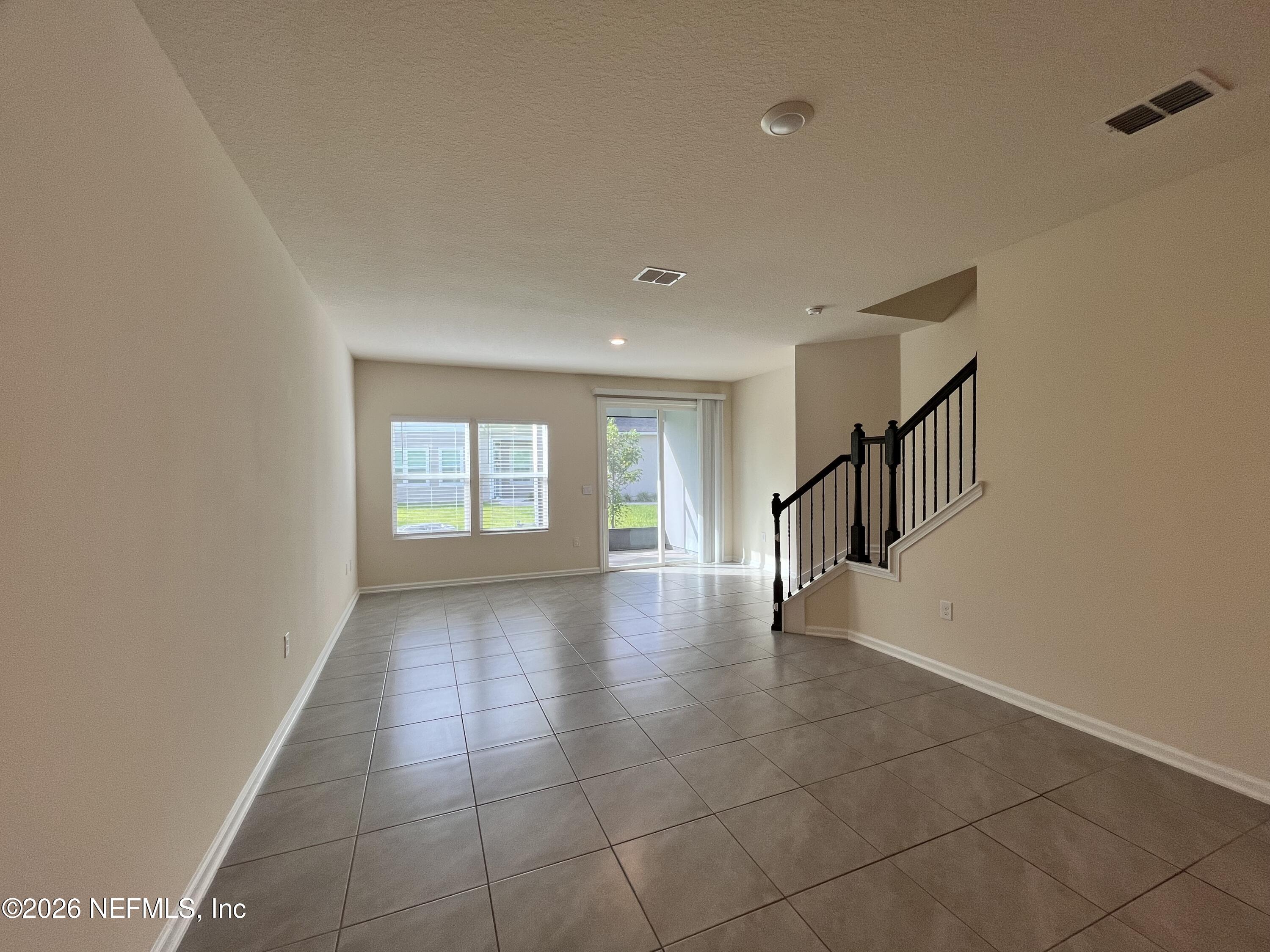 548 Coastline Way St. Augustine, FL 32092 - Photo 7 of 21 a view of an empty room with a window