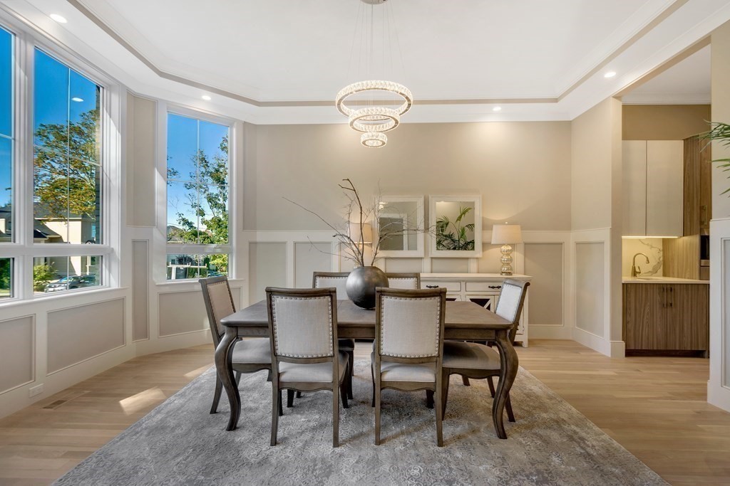 50 Gould Road Newton, MA 02468 - Photo 6 of 12 a view of a dining room with furniture and a potted plant