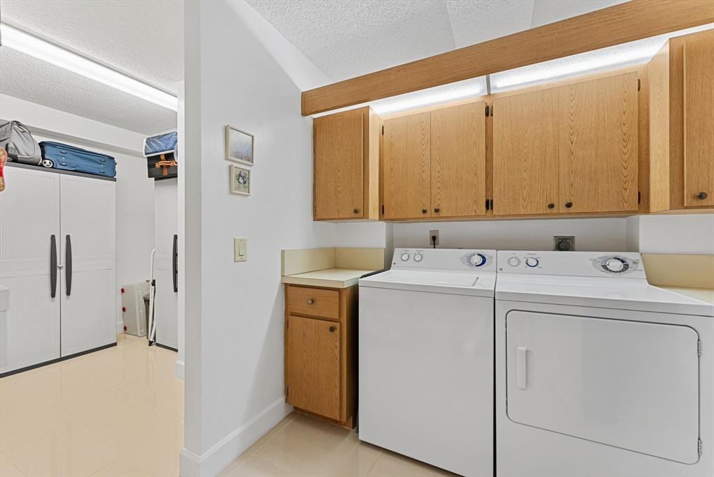 6217 Balboa Circle, Unit 305 Boca Raton, FL 33433 - Photo 22 of 28 a utility room with dryer and washer