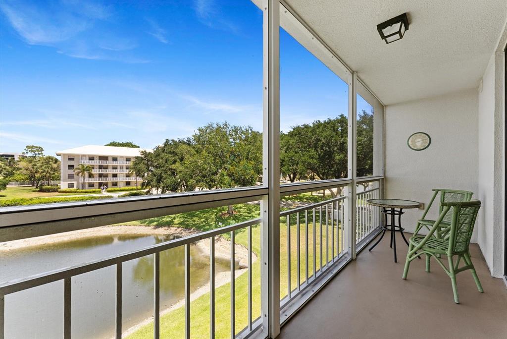 6217 Balboa Circle, Unit 305 Boca Raton, FL 33433 - Photo 27 of 28 a view of a city from a balcony with furniture
