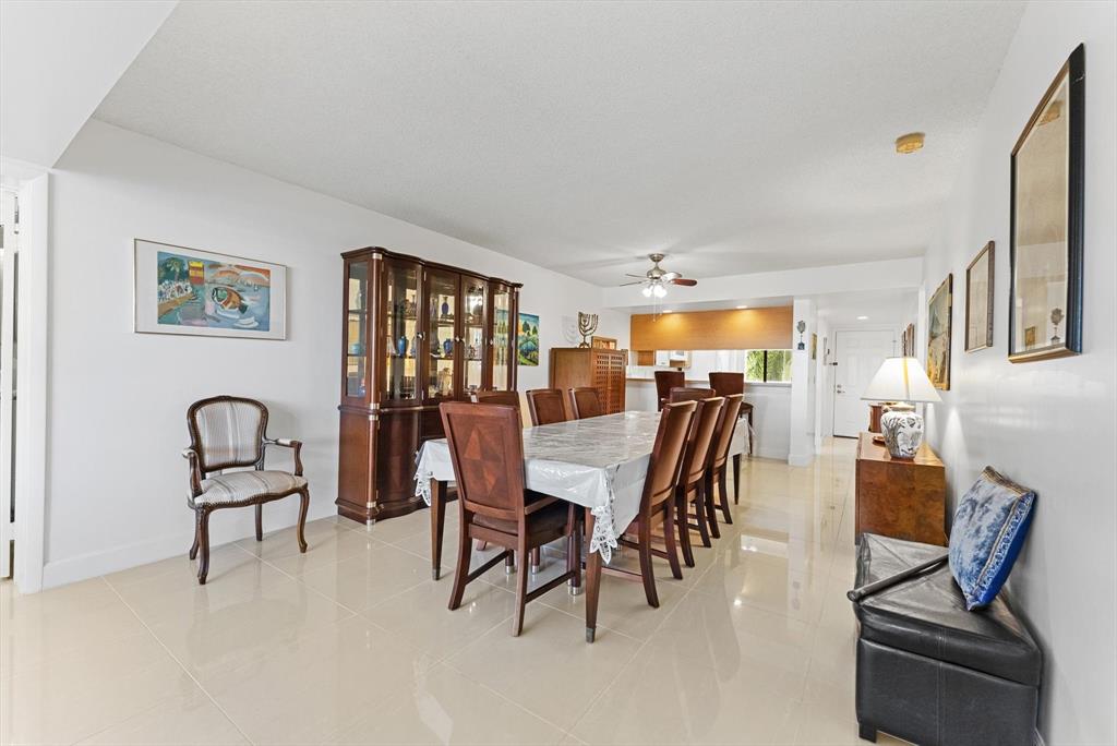 6217 Balboa Circle, Unit 305 Boca Raton, FL 33433 - Photo 10 of 28 a dining room with furniture and window