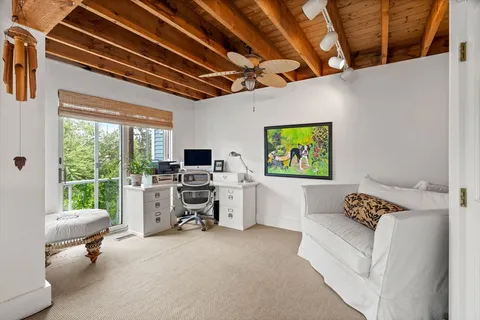 a workspace with furniture and a window