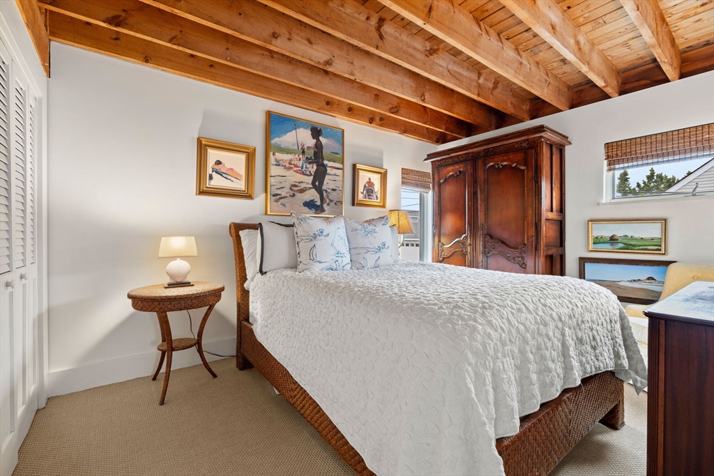 10 61st Street, Unit 10 Newburyport, MA 01950 - Photo 12 of 42 a bedroom with a bed and a window