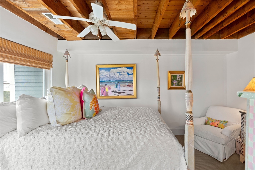 10 61st Street, Unit 10 Newburyport, MA 01950 - Photo 17 of 42 a bedroom with a bed and a couch