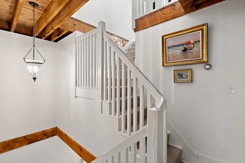 a view of entryway with stairs and wooden floor