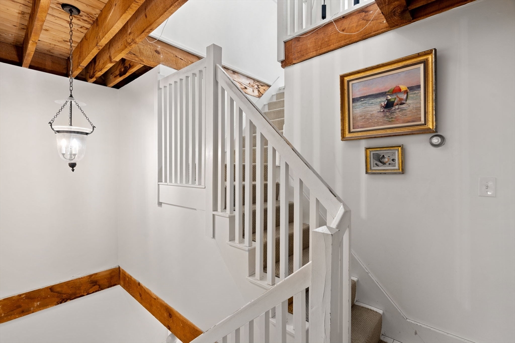10 61st Street, Unit 10 Newburyport, MA 01950 - Photo 23 of 42 a view of entryway with stairs and wooden floor