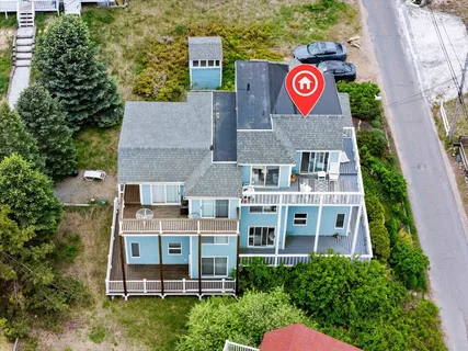 an aerial view of residential house with an outdoor space