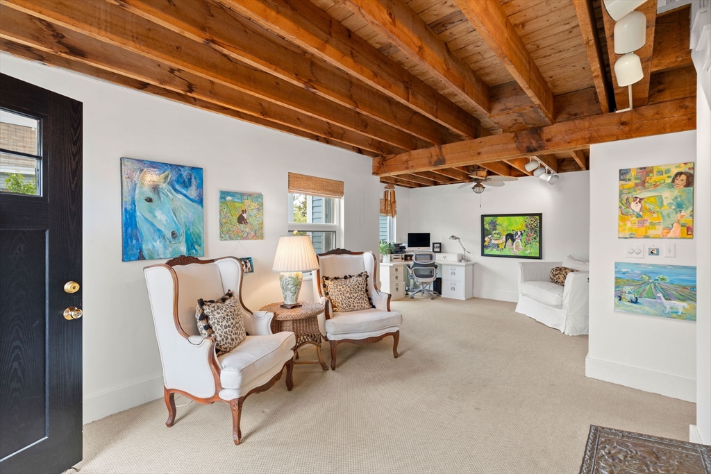 10 61st Street, Unit 10 Newburyport, MA 01950 - Photo 7 of 42 a living room with furniture and a large window