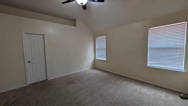 an empty room with a empty space and a window