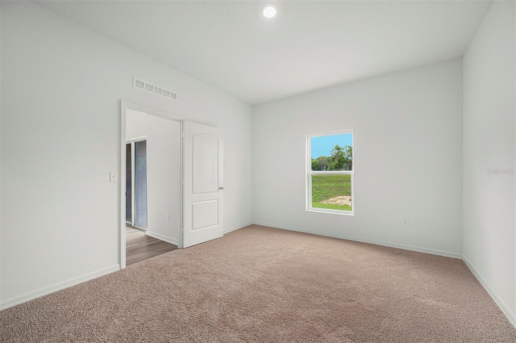 13352 Tula Loop Astatula, FL 34705 - Photo 11 of 19 an empty room with windows