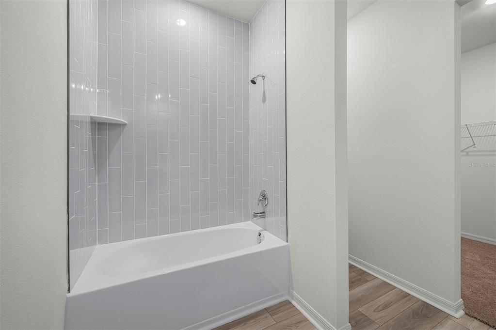 13352 Tula Loop Astatula, FL 34705 - Photo 14 of 19 a bathroom with a bathtub