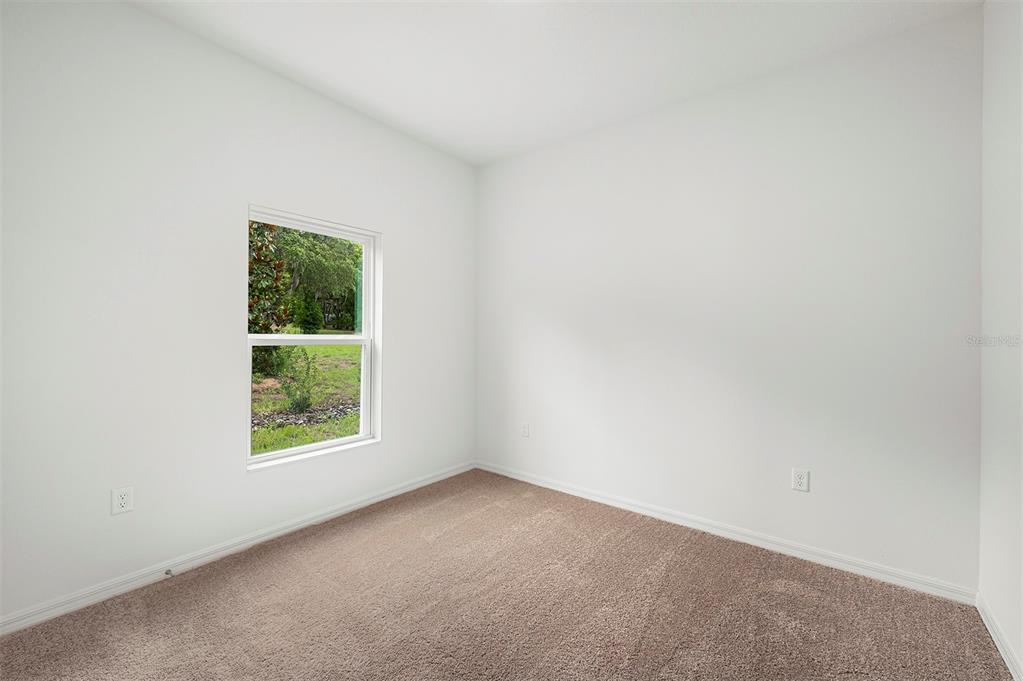 13352 Tula Loop Astatula, FL 34705 - Photo 16 of 19 an empty room with a window