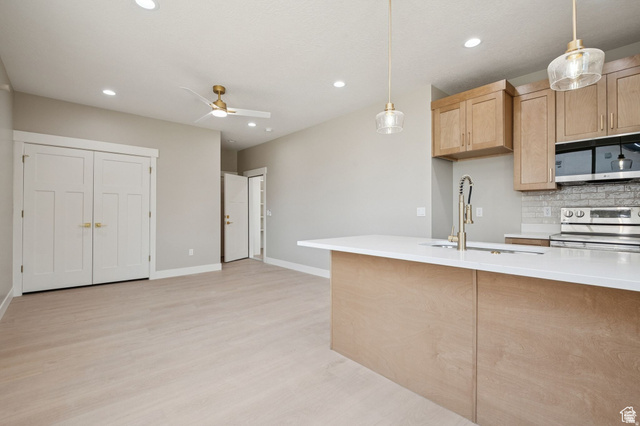1471 Colbey Loop Santa Clara, UT 84765 - Photo 19 of 45 Open-concept living space with wood-finish flooring