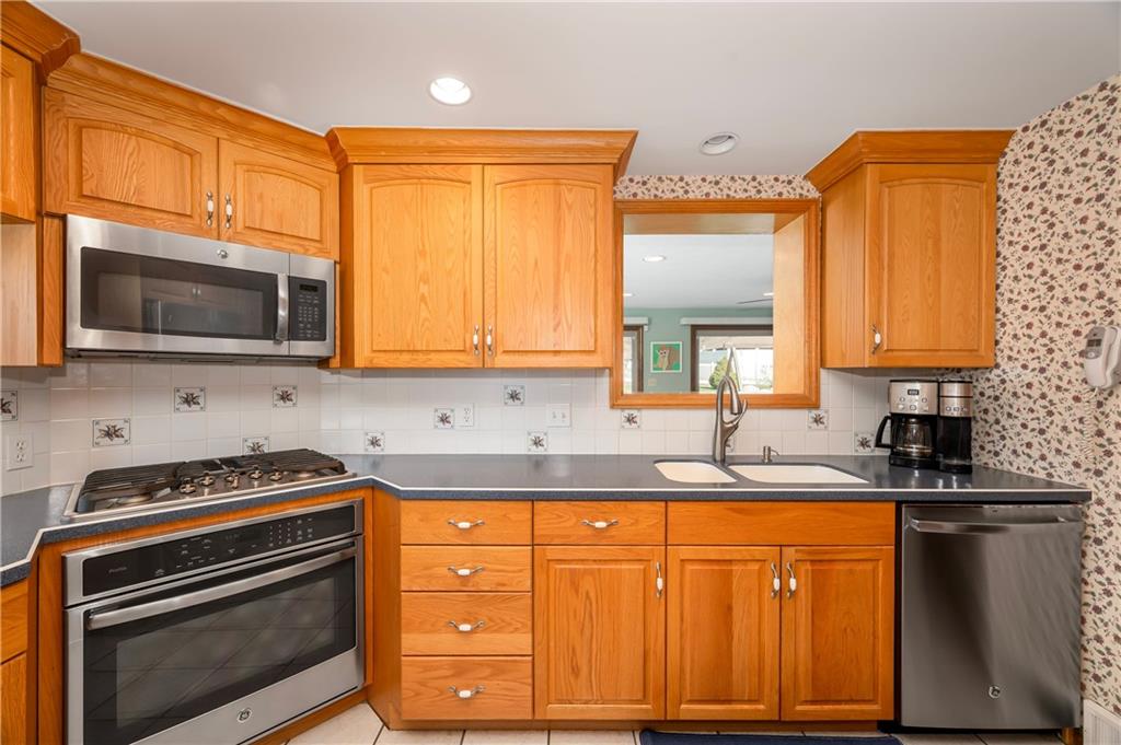502 Nichols Road Pittsburgh, PA 15237 - Photo 13 of 46 a kitchen with granite countertop cabinets stainless steel appliances a sink and a window