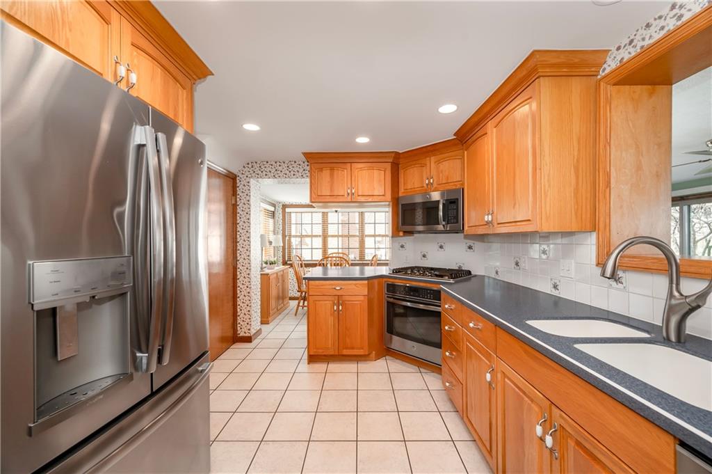 502 Nichols Road Pittsburgh, PA 15237 - Photo 14 of 46 a kitchen with stainless steel appliances granite countertop a refrigerator a sink a stove top oven and a refrigerator