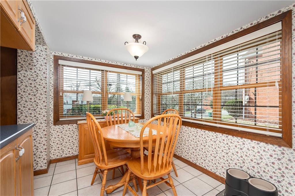 502 Nichols Road Pittsburgh, PA 15237 - Photo 15 of 46 a view of a dining room with furniture large windows and wooden floor