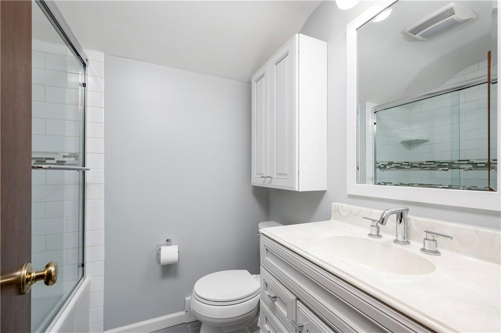 502 Nichols Road Pittsburgh, PA 15237 - Photo 29 of 46 a bathroom with a granite countertop sink toilet a mirror and shower