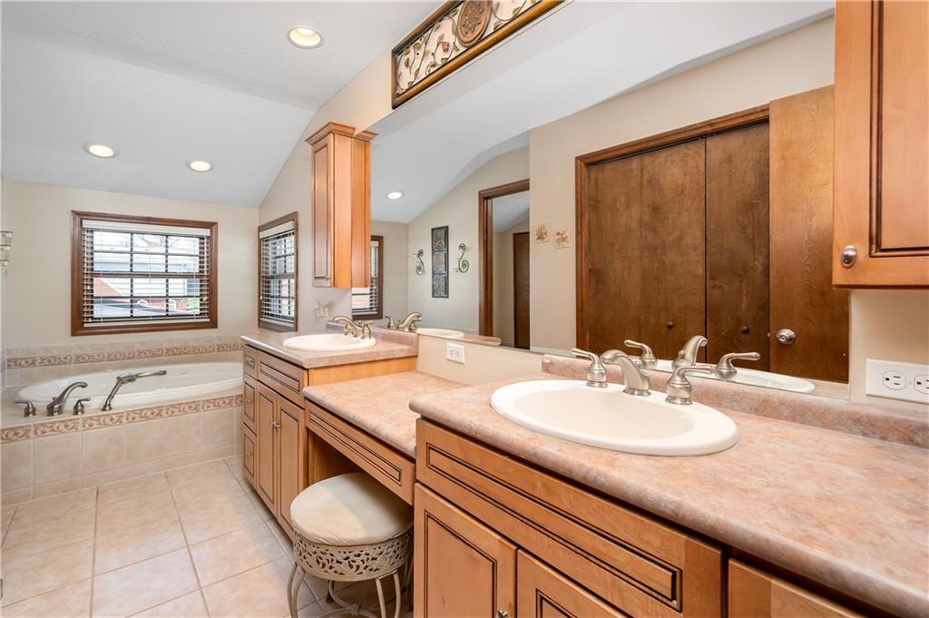 502 Nichols Road Pittsburgh, PA 15237 - Photo 32 of 46 a bathroom with a granite countertop sink and a mirror