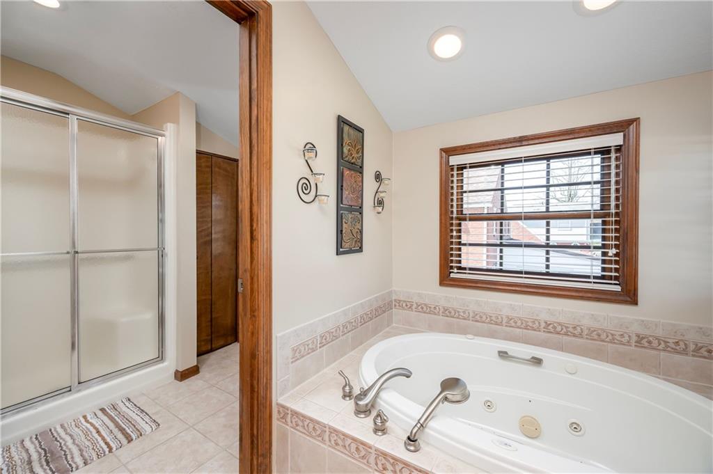 502 Nichols Road Pittsburgh, PA 15237 - Photo 33 of 46 a bathroom with a tub sink and mirror