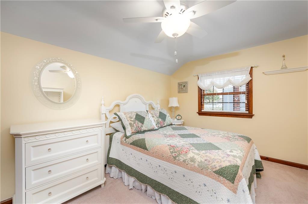502 Nichols Road Pittsburgh, PA 15237 - Photo 36 of 46 a bedroom with a bed and a chandelier