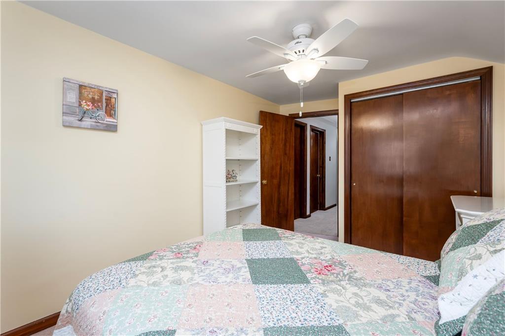 502 Nichols Road Pittsburgh, PA 15237 - Photo 37 of 46 a bedroom with a large bed and a chandelier