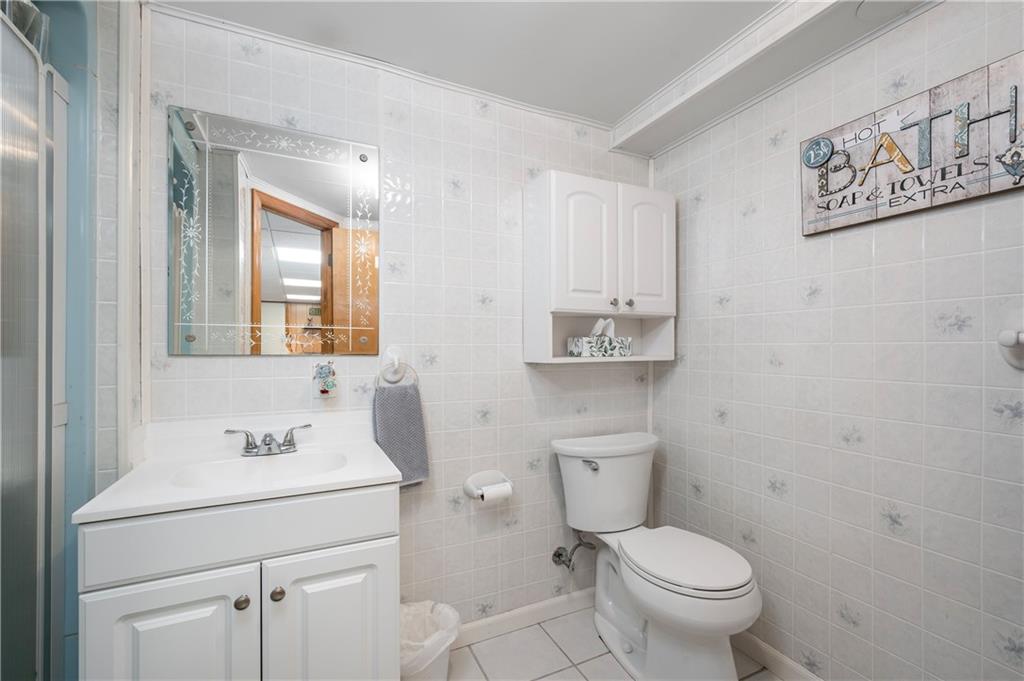 502 Nichols Road Pittsburgh, PA 15237 - Photo 40 of 46 a bathroom with a toilet sink vanity and mirror