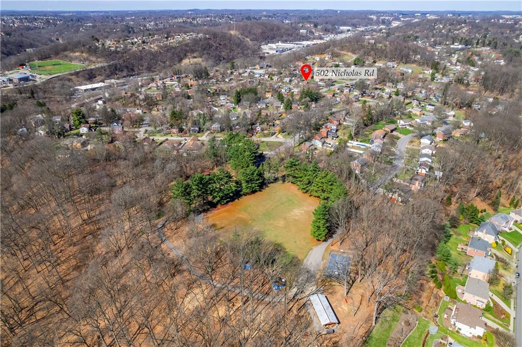 502 Nichols Road Pittsburgh, PA 15237 - Photo 46 of 46 an aerial view of a houses with a lush green hillside