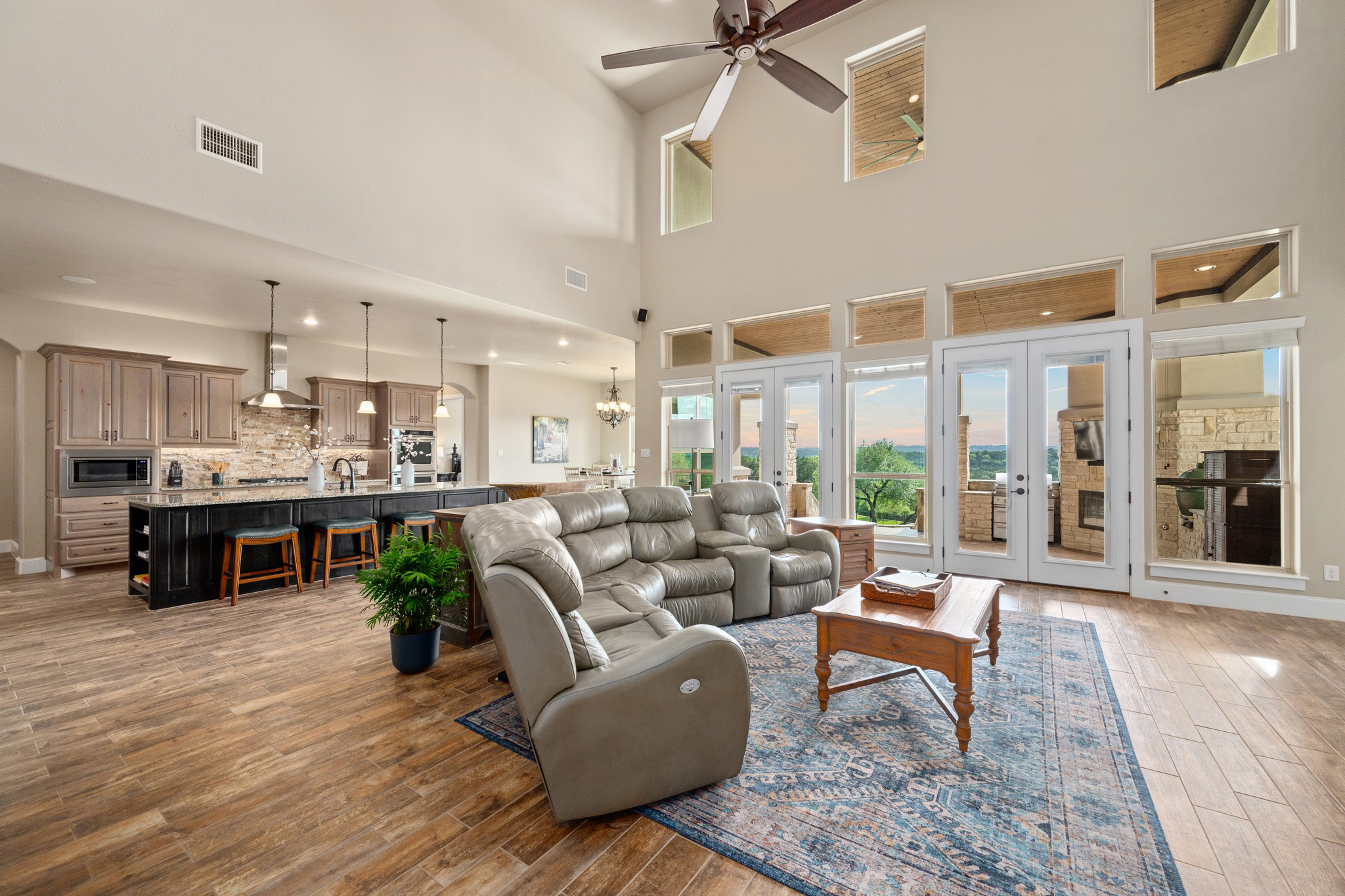 204 Wilderness Trail Georgetown, TX 78633 - Photo 11 of 38 a living room with furniture kitchen view and large windows