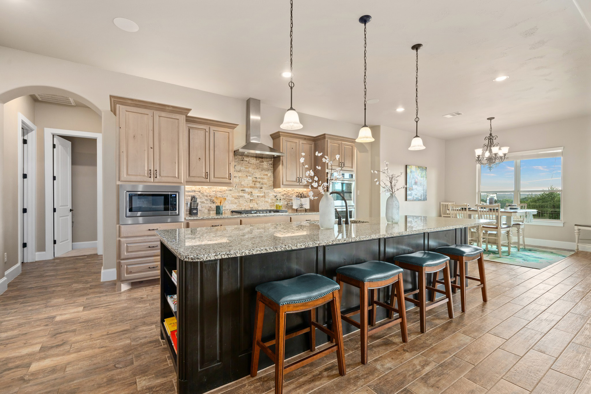 204 Wilderness Trail Georgetown, TX 78633 - Photo 14 of 38 a large kitchen with a table and chairs