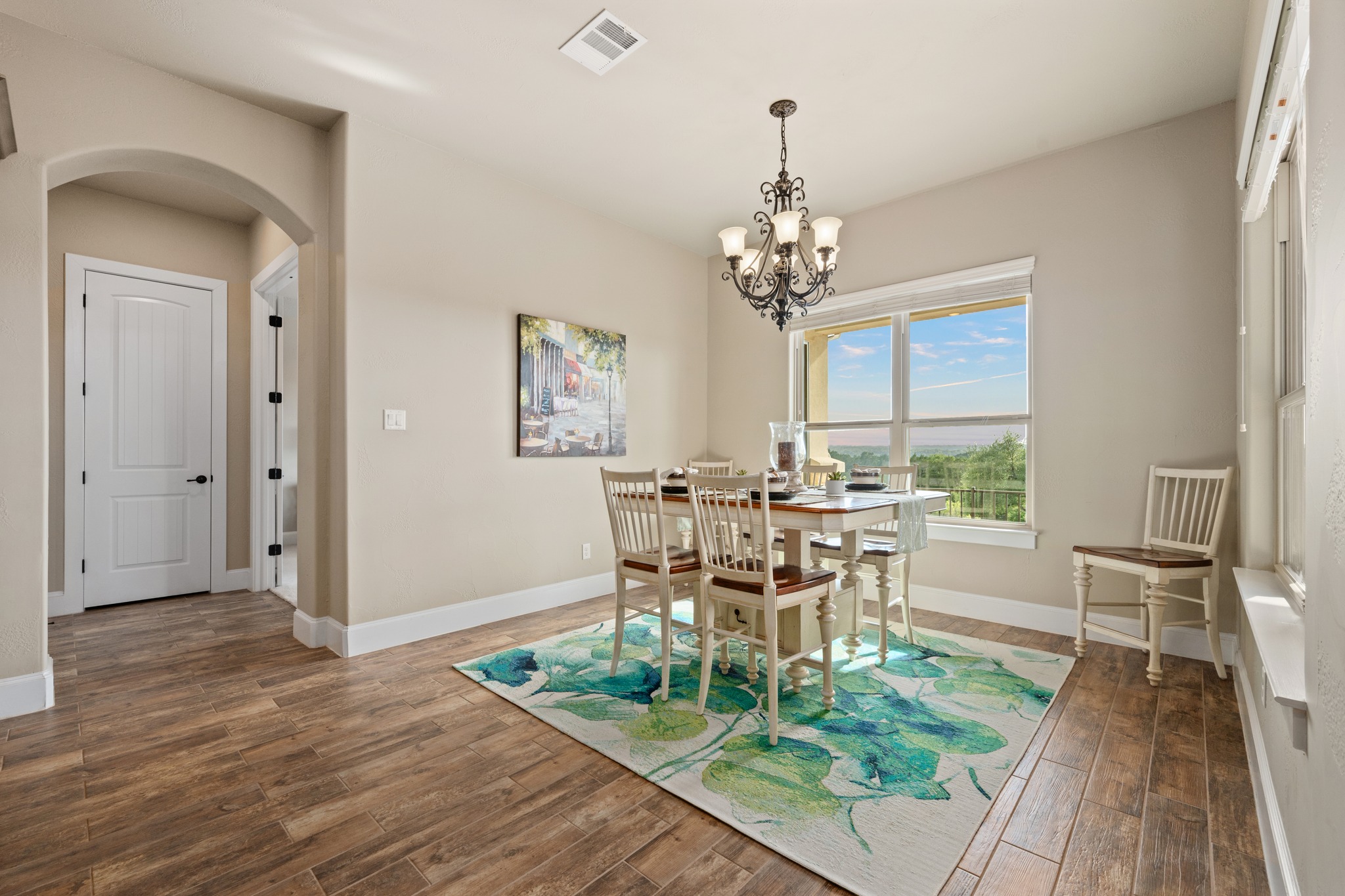 204 Wilderness Trail Georgetown, TX 78633 - Photo 17 of 38 a view of a dining room with furniture a chandelier and wooden floor