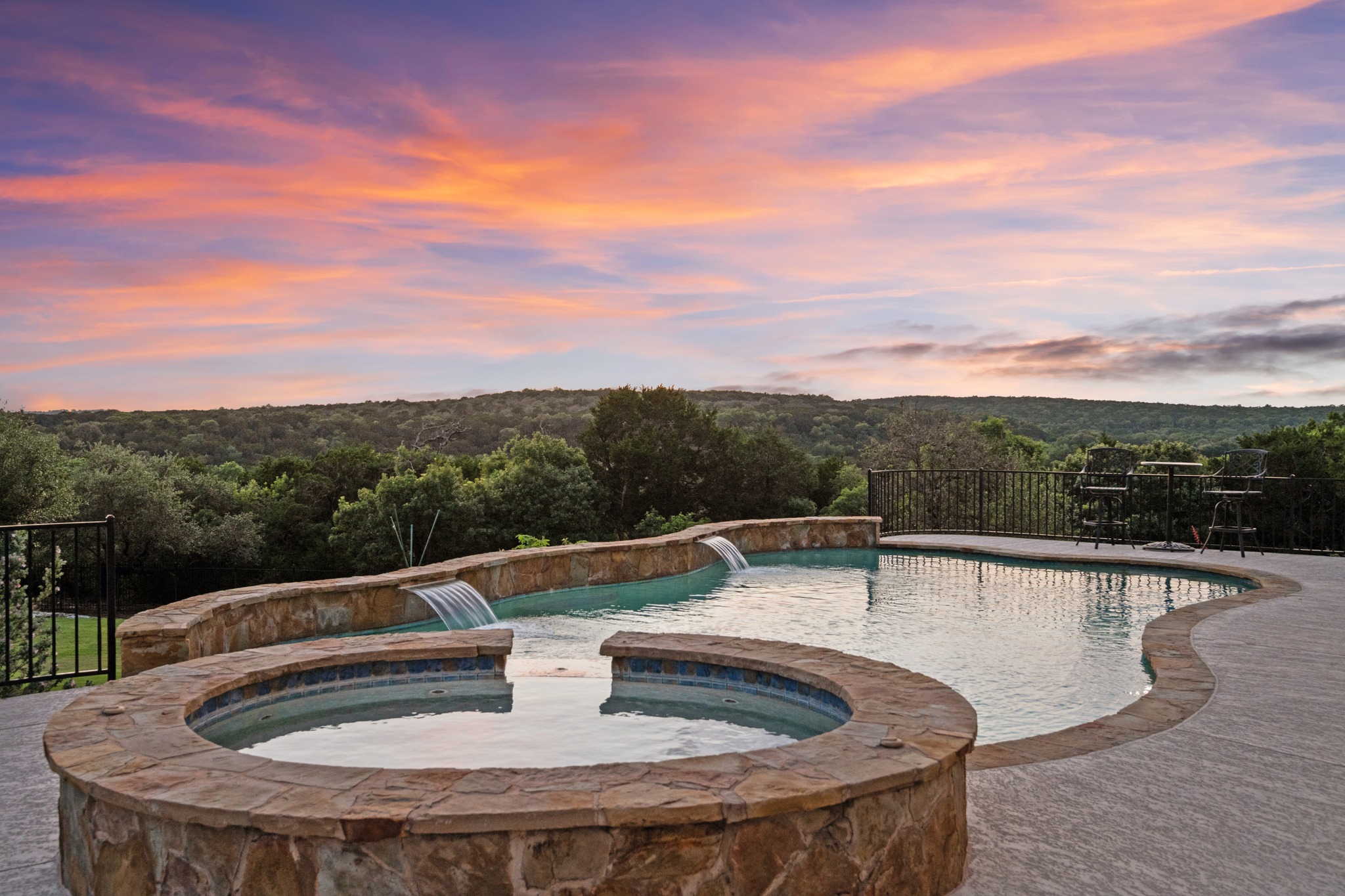 204 Wilderness Trail Georgetown, TX 78633 - Photo 2 of 38 a view of swimming pool with lake view and mountain in the background